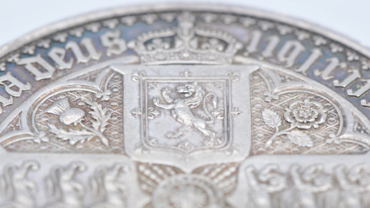 Detail from the reverse of a superb deep cameo Gothic Crown. Achieving detail this fine on a surface of just 38mm diameter speaks to the skill of its engraver, William Wyon.