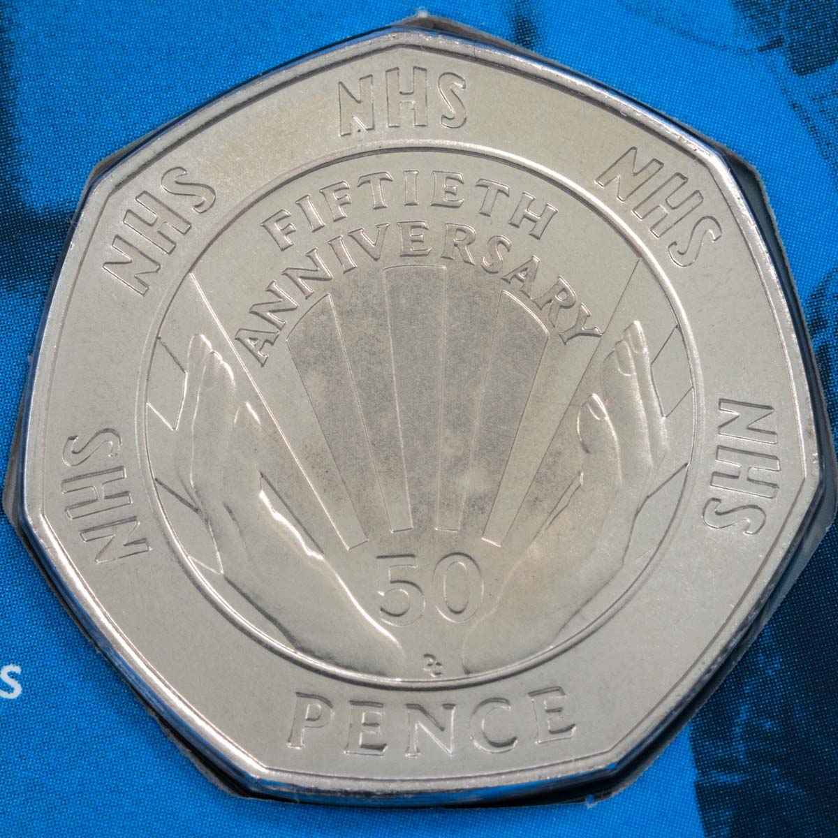 1998 National Health Service Fifty Pence Brilliant Uncirculated Coin In Folder Reverse